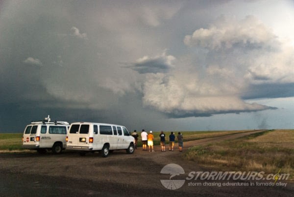 storm chase tours group with vans watching storm